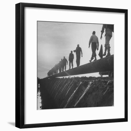 Men Laying Pipeline-null-Framed Premium Photographic Print