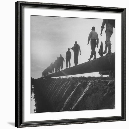 Men Laying Pipeline-null-Framed Premium Photographic Print