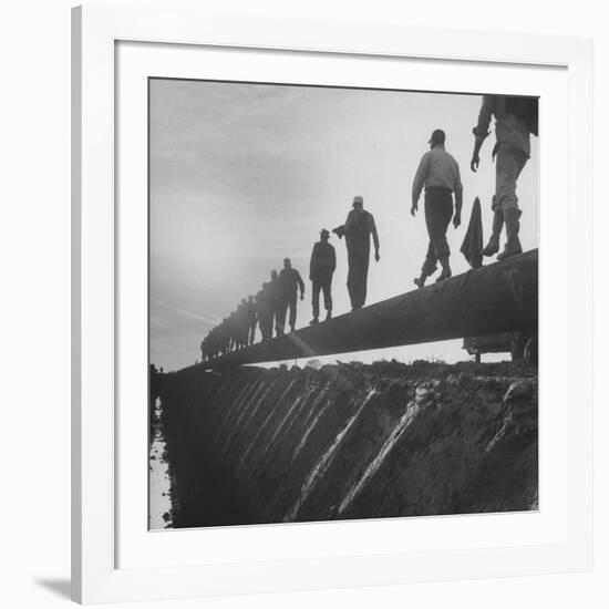 Men Laying Pipeline-null-Framed Premium Photographic Print