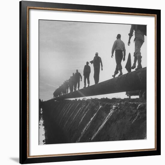 Men Laying Pipeline-null-Framed Premium Photographic Print