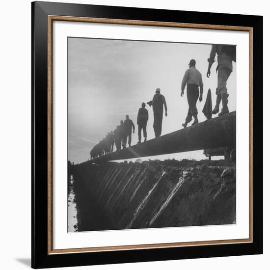 Men Laying Pipeline-null-Framed Premium Photographic Print