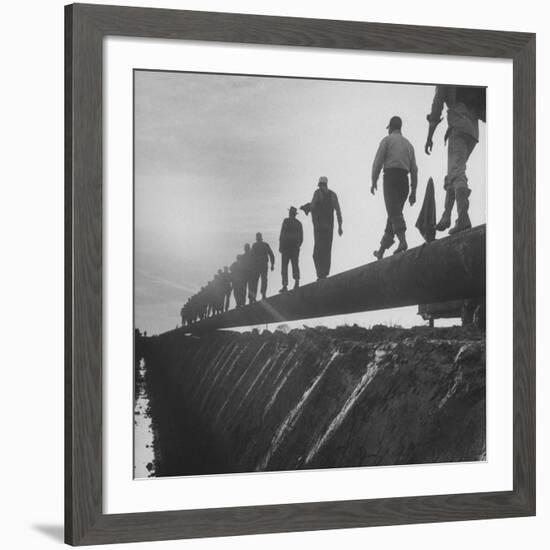 Men Laying Pipeline-null-Framed Premium Photographic Print