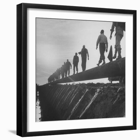 Men Laying Pipeline-null-Framed Photographic Print