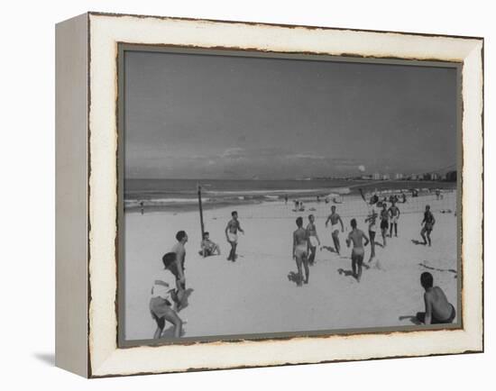 Men Playing a Game of Volleyball on the Beach-null-Framed Premier Image Canvas