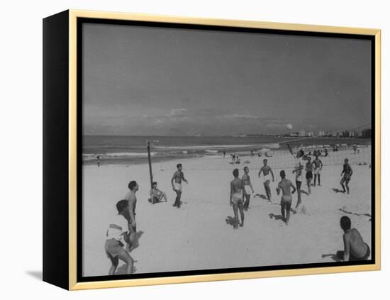 Men Playing a Game of Volleyball on the Beach-null-Framed Premier Image Canvas