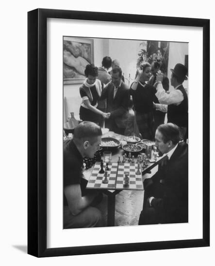 Men Playing Chess at a Cocktail Party-Francis Miller-Framed Photographic Print