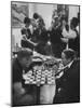 Men Playing Chess at a Cocktail Party-Francis Miller-Mounted Photographic Print