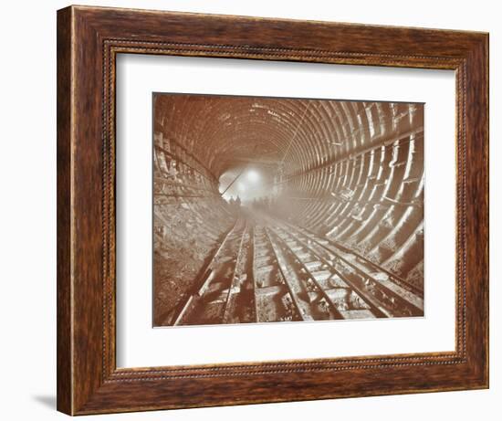 Men Pushing Railway Trucks Along the Rotherhithe Tunnel, Stepney, London, June 1907-null-Framed Photographic Print