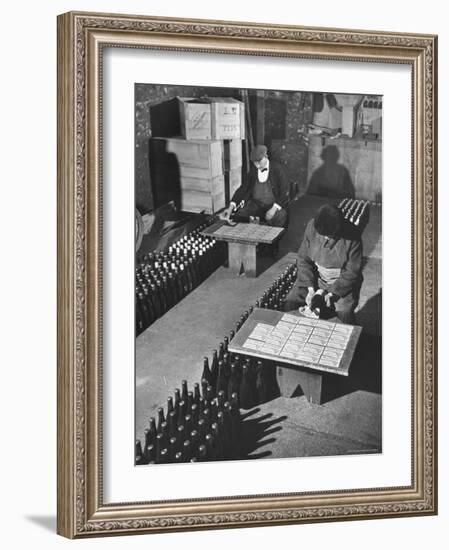 Men Putting Labels on Wine Bottles-Ralph Morse-Framed Photographic Print