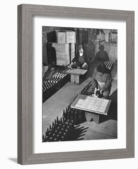 Men Putting Labels on Wine Bottles-Ralph Morse-Framed Photographic Print