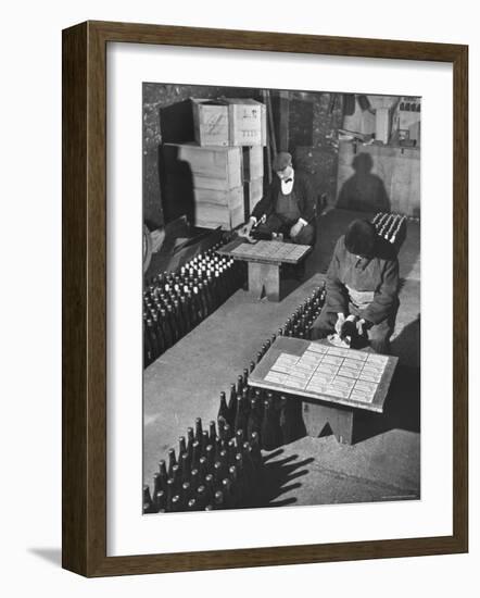 Men Putting Labels on Wine Bottles-Ralph Morse-Framed Photographic Print