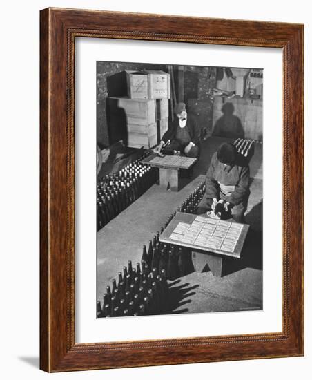 Men Putting Labels on Wine Bottles-Ralph Morse-Framed Photographic Print