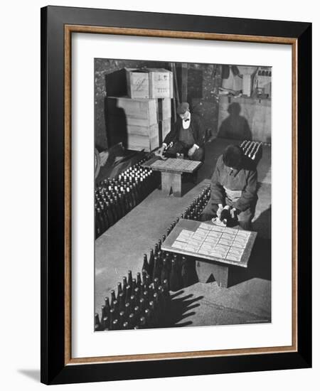 Men Putting Labels on Wine Bottles-Ralph Morse-Framed Photographic Print