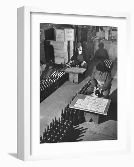 Men Putting Labels on Wine Bottles-Ralph Morse-Framed Photographic Print