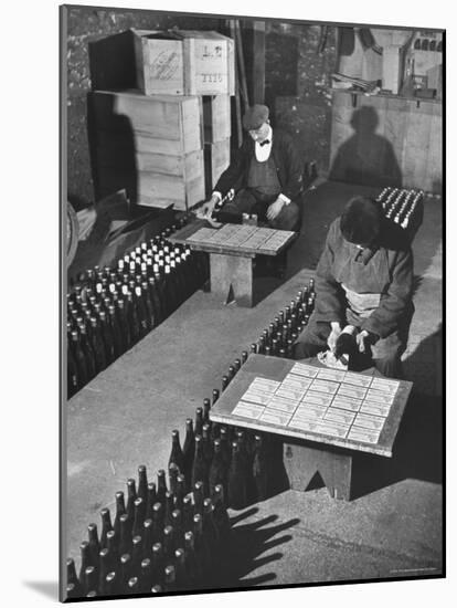 Men Putting Labels on Wine Bottles-Ralph Morse-Mounted Photographic Print