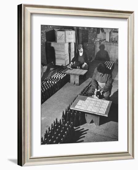 Men Putting Labels on Wine Bottles-Ralph Morse-Framed Photographic Print