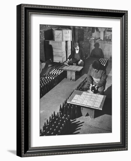 Men Putting Labels on Wine Bottles-Ralph Morse-Framed Photographic Print