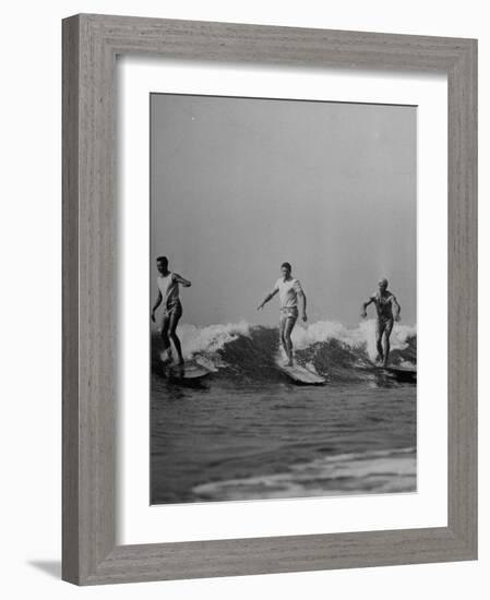 Men Riding the Waves on Surf Boards-null-Framed Photographic Print