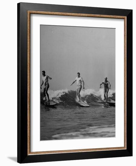 Men Riding the Waves on Surf Boards-null-Framed Photographic Print