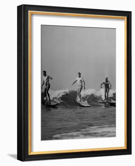 Men Riding the Waves on Surf Boards-null-Framed Photographic Print