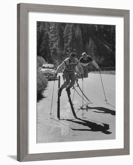 Men Roller Skiing in the Streets-null-Framed Photographic Print