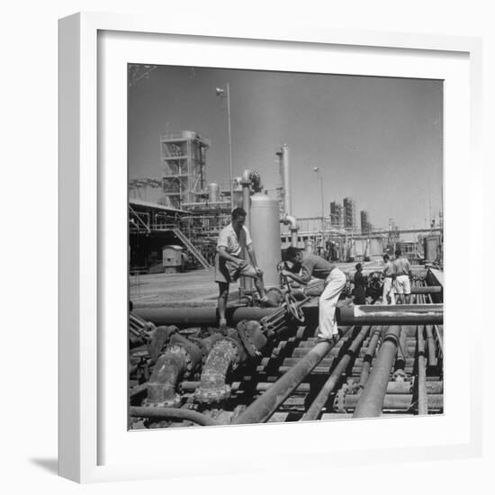 Men Shutting Off Output Valves-Dmitri Kessel-Framed Photographic Print