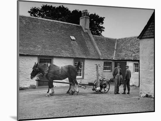 Men Standing Near Horse-Drawn Farming Equipment-null-Mounted Photographic Print