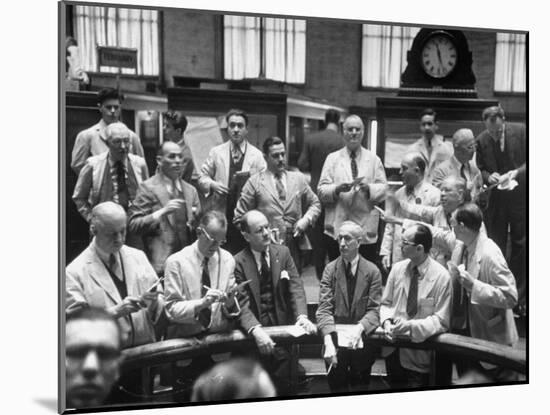 Men Trading, Buying and Selling Stocks-Ralph Morse-Mounted Photographic Print