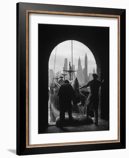 Men Unloading Coffee at Brooklyn Dock. View of Downtown Manhattan in Background-Andreas Feininger-Framed Photographic Print