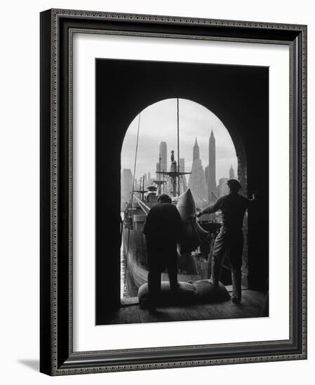 Men Unloading Coffee at Brooklyn Dock. View of Downtown Manhattan in Background-Andreas Feininger-Framed Photographic Print