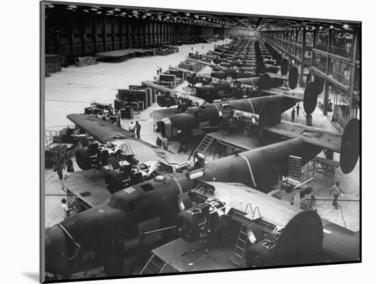 Men Working on Consolidated Aircrafts-Dmitri Kessel-Mounted Photographic Print