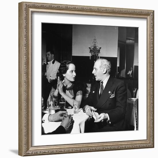 Merle Oberon and Walter Winchell Chatting at the Stork Club-null-Framed Photographic Print