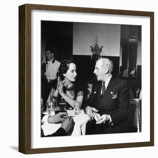 Merle Oberon and Walter Winchell Chatting at the Stork Club-null-Framed Photographic Print