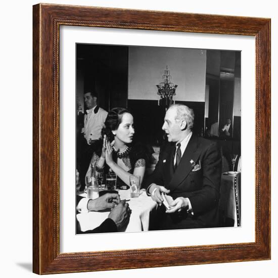Merle Oberon and Walter Winchell Chatting at the Stork Club-null-Framed Photographic Print