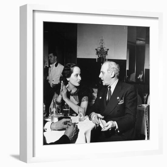 Merle Oberon and Walter Winchell Chatting at the Stork Club-null-Framed Photographic Print