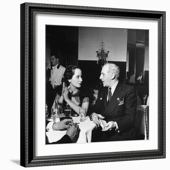 Merle Oberon and Walter Winchell Chatting at the Stork Club-null-Framed Photographic Print
