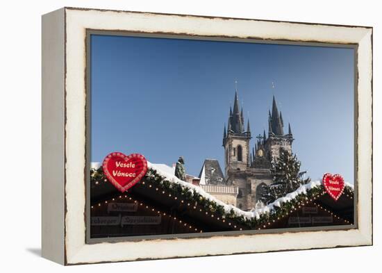 Merry Christmas Sign at Snow-Covered Christmas Market and Tyn Church-Richard Nebesky-Framed Premier Image Canvas