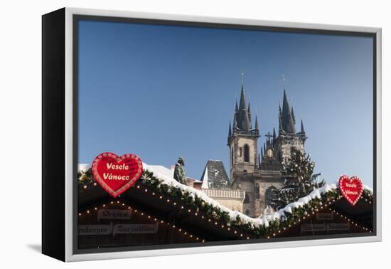 Merry Christmas Sign at Snow-Covered Christmas Market and Tyn Church-Richard Nebesky-Framed Premier Image Canvas