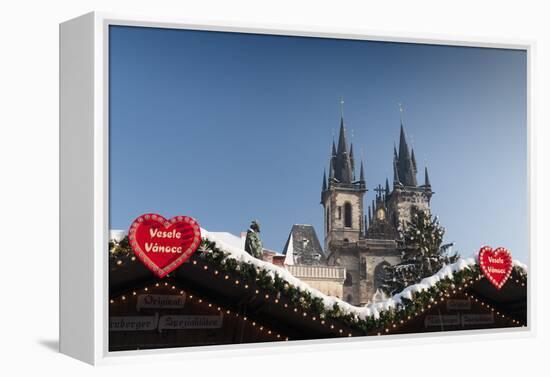 Merry Christmas Sign at Snow-Covered Christmas Market and Tyn Church-Richard Nebesky-Framed Premier Image Canvas