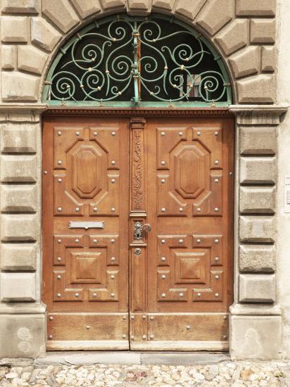 Metal Design Arched Over Decorative Wooden Doors Photographic Print Art Com