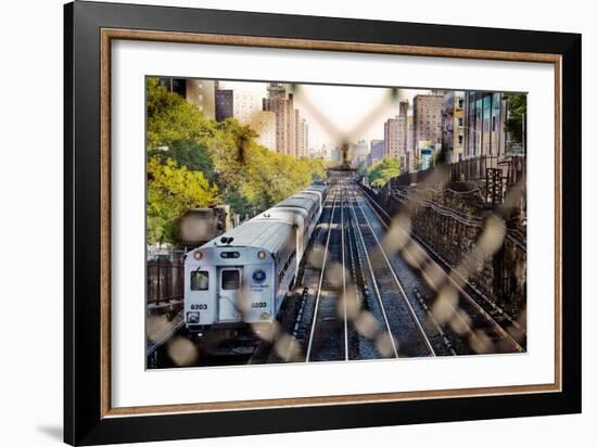 Metro North Train Through Fence-null-Framed Photo