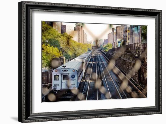 Metro North Train Through Fence-null-Framed Photo