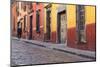 Mexico, San Miguel de Allende. Elderly man walks up sidewalk.-Don Paulson-Mounted Photographic Print