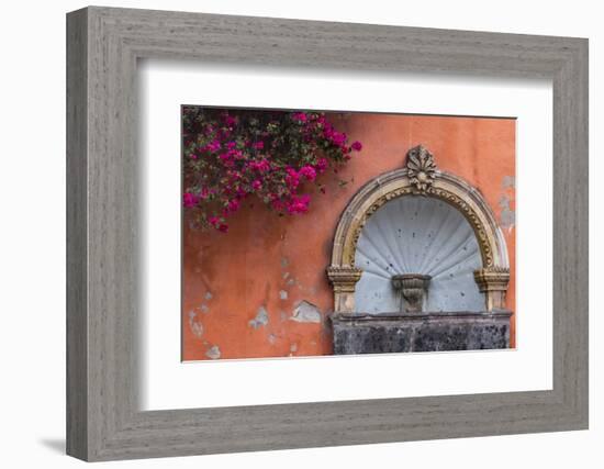 Mexico, Street Fountain Built into a Salmon Colored Wall with Fuschia Flowering Branch-Judith Zimmerman-Framed Photographic Print