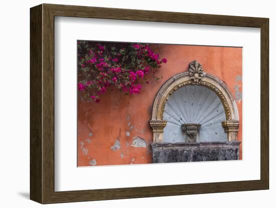 Mexico, Street Fountain Built into a Salmon Colored Wall with Fuschia Flowering Branch-Judith Zimmerman-Framed Photographic Print