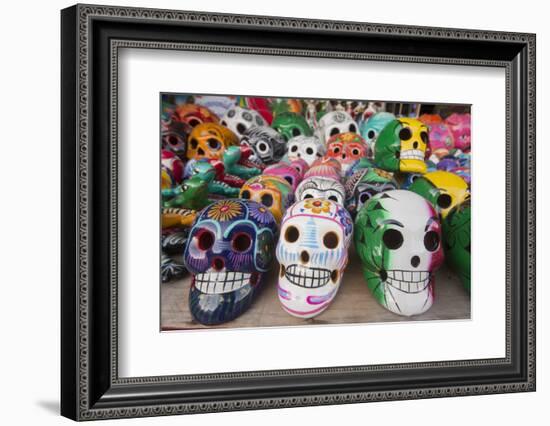 Mexico, Yucatan, Isla Mujeres, colorful ceramic calavera skulls for sale in market.-Merrill Images-Framed Photographic Print