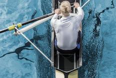 Top View of Athletic Competition Rower, Who Strokes His Paddle through Metallic Blue Water.-mezzotint-Photographic Print