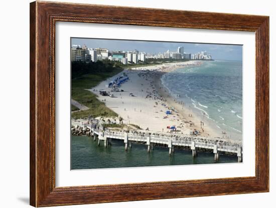 Miami Beach in Florida, with People Sunbathing on Golden Sands and the Waves from the Blue Sea-Natalie Tepper-Framed Photo