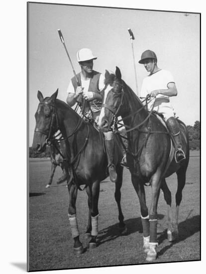 Michael Phipps Talking to a Fellow Polo Player-Nina Leen-Mounted Premium Photographic Print