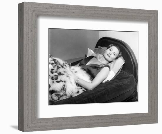 Michèle Morgan Laid on a Bed, 1951-Marcel Begoin-Framed Photographic Print